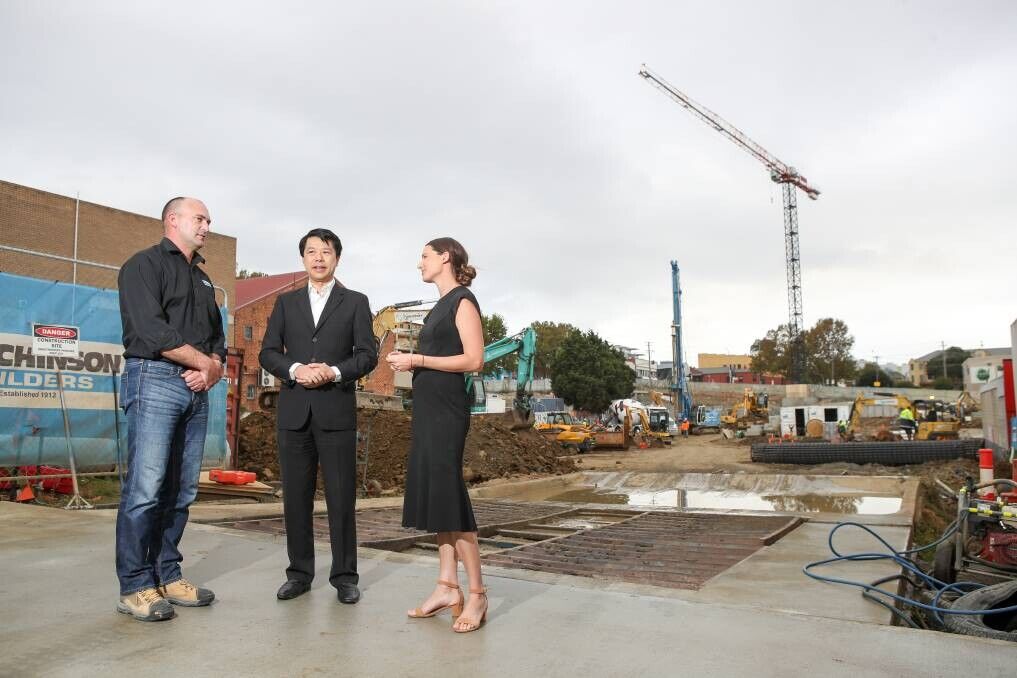 Shane Wilson, project manager for Hutchinson Builders with Alex Lei from developers BRDB and Holly Charters from Colliers / Picture: Adam McLean (Illawarra Mercury)